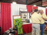 Missouri AgrAbility staff members greet Western Farm Show attendees.