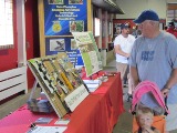 Indiana State Fair visitors check out the Assistive Technology display.