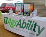 MN AgrAbility's table at the Farmfest Farm Show.