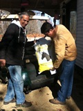 Armando Longoria and Jeff Via, Fayette County Extension Director, show off veteran Armando's new golf cart.