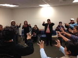 Participants doing Cat Claw exercise.
