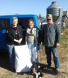 Sue, Ken, and new PHARM Dog Dora, a recent placement.