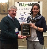 NC AgrAbility Project Coordinator Michele Proctor was presented with a 2014 Breaking New Ground Achievement Award by Dr. Bill Field.