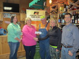 MI AgrAbility receiving Farm Bureau check at Andy T's