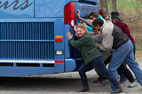 NTW group "pushing" stuck tour bus
