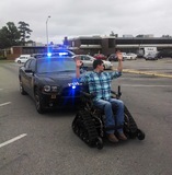 AR farmer Jacob Grigg being "arrested" for speeding on Trackchair