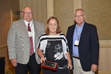Linda Tarr, IN AgrA, accepting IN AgrA public service award from IN Rural Health Assoc.