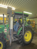 Roger Pellegrini on John Deere tractor