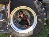 Playing inside tractor wheel at Farm Science Review