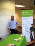 GA AgrAbility's Mason Dean at booth for 40th Farm, Home & Ministers Conference