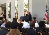 Participants listening to speaker at briefing