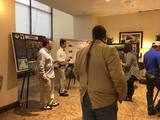 Participants looking at poster session during FALCON conference