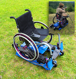 Freedom-Trax Powered Track Attachment on manual wheelchair with inset of user outside shooting a rifle