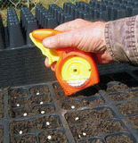 Person using SowEZ Hand-Held Seeder