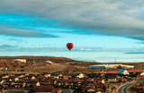Hot air balloon above cityscape Albuquerque, NM