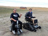 Pine Ridge AgrAbility Workshop participants Vine King (L) and Nick Ciaramitaro on motorized wheelchairs