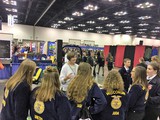 Sierra Royster from APRIL sharing with FFA members at AgrAbility booth FFA Convention