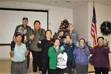 Hmong workshop participants with gloves