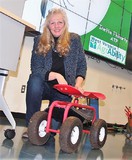 Inetta Fluharty, WV AgrAbility, next to a Garden Scoot at the "For the Love of Gardening" workshop