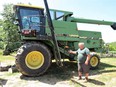 Tom Wing next to combine
