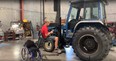 Tim Barger on tractor lift
