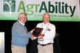 Tim Prather receiving the award for 25 years of service to AgrAbility