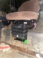 Picture of a brown tractor seat installed on a tractor