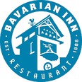 Round blue and white logo of the Bavarian Inn and Restaurant established in 1888 showing a drawing of the Inn's clock and bell tower.