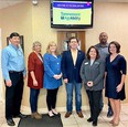 3 men & 4 women at STARCenter standing under large screen that reads TENNESSEE AGRABILITY