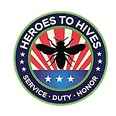 Round logo of HEROES TO HIVES with outer and inner green circle borders & picture of a black bee against red & white strips with blue section & 3 white stars below bee.