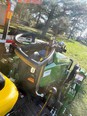 Drivers seat view of John Deere tractor with assistive technology modifications.