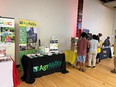 AgrAbility display table with AgrAbility banner in background at Black Loam Conference in Indianapolis