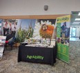 Indiana AgrAbility table with printed material and AgrAbility banner.