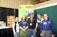 MO AgrAbility staff standing in front of their AgrAbility booth at the MO Western Farm Show