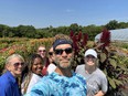 Selfie of Charlie Jordon with 5 OT students and fields of flowers in the background