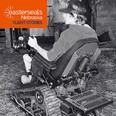 Black & white slide of a young man in a Trackchair with an orange sign in the upper left corner reading EASTERSEALS NEBRASKA CLIENT STORIES