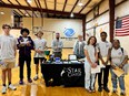 Star Center display table surrounded by African American and Caucasion youth