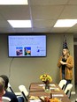 Ellis Vidmar speaking to Washington County Farm Bureau members in a classroom