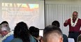 Don McMoran wearing a Hawaiian lei around his neck teaching a session at the Hawaii Regional Workshop