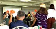 A group of people with Esmeralda Mandujano in front in a session at the Hawaii Regional Workshop