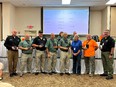 Group picture of 7 men & Joetta White standing in front of a table with the men holding their FRIEND OF TN AGRABILITY awards.