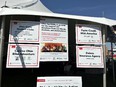 Thank you posters from OH AgrAbility to supporting groups - agencies - and donors - posted under a tent awning.