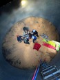 Picture from the top of a grain bin looking down on a grain bin rescue operation with 5 rescuers and the victim.