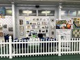 FL AgrAbility booth behind white picket fence inside a building