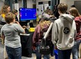 Jeopardy game with youth standing around it at Purdue Extension display