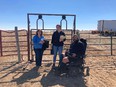 2 female and 1 male CO AgrAbility interns - the male in a motorized wheelchair - in front of a corral