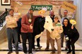 GA AgrAbilitys staff holding various signs standing around the animatronic bull T-bone at NTW