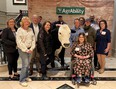 TN AgrAbility staff and farmers next to animatronic bull T-bone with AgrAbility sign in the background