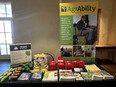 A CA AgrAbility display table and banner in a room