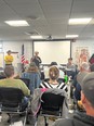 Maine AgrAbility sharing at Fisherman Safety Day in a large classroom